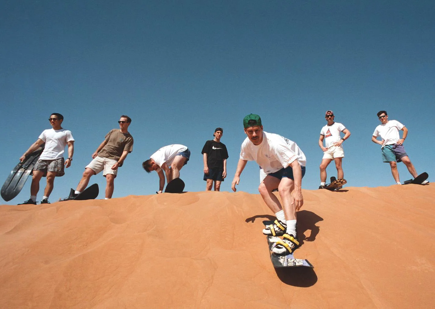 An exhilarating desert adventure, filled with activities like dune bashing, quad biking, camel rides